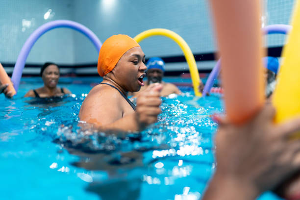 istock People exercising in the swimming pool 1450598661
