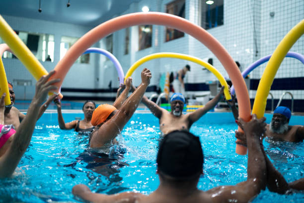istock People exercising in the swimming pool 1450598665