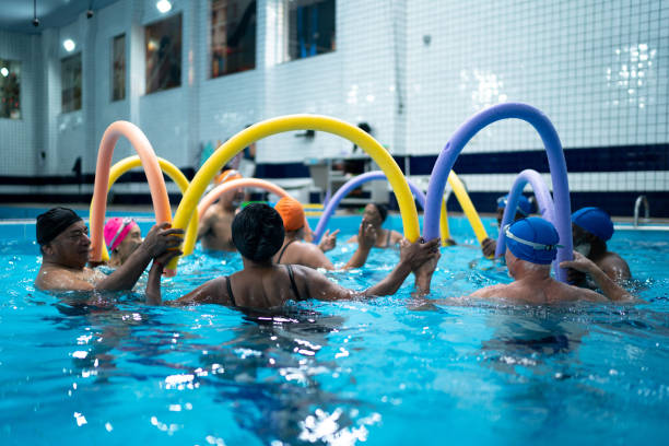 istock People exercising in the swimming pool 1450598668