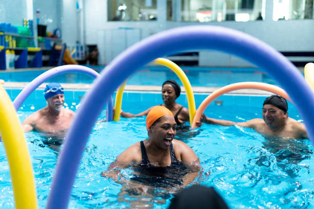 istock People exercising in the swimming pool 1450599195