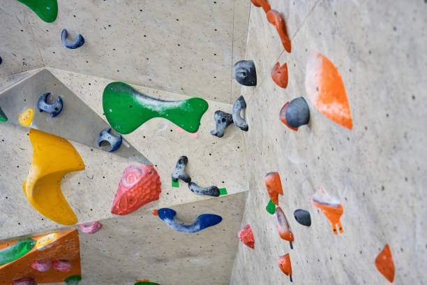 istock Bouldering gym with artificial colourful rock wall 1450599767