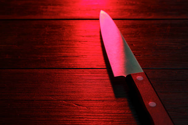 Kitchen knife on dark background Kitchen knife on dark background manhunt law enforcement stock pictures, royalty-free photos & images