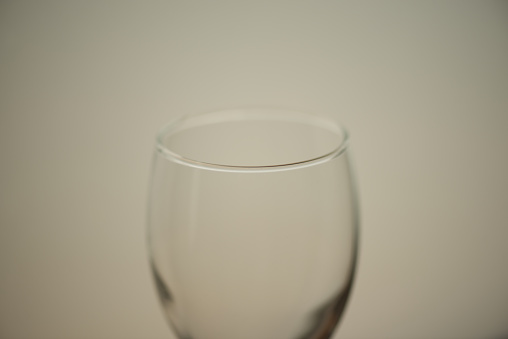 Macro takes a picture of a wine glass.