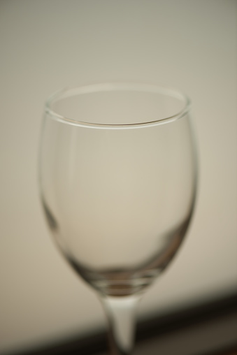 Macro takes a picture of a wine glass.