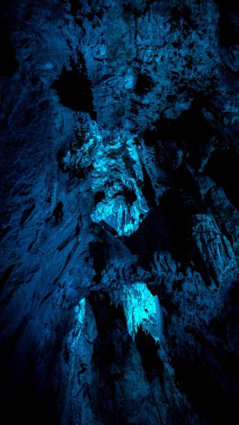 istock Inside of a cave lit up in blue light 1450604914