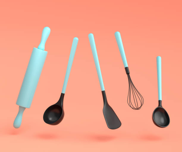 istock Wooden kitchen utensils, tools and equipment on coral background. 1450616895