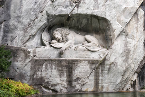 The Lion Monument in Lucerne, Switzerland The Lion Monument is located in the center of Lucerne and commemorates, in the allegory of a dying lion, the Swiss Guardsmen who fell on August 10, 1792 during the Tuileries Storm in Paris lucerne switzerland stock pictures, royalty-free photos & images