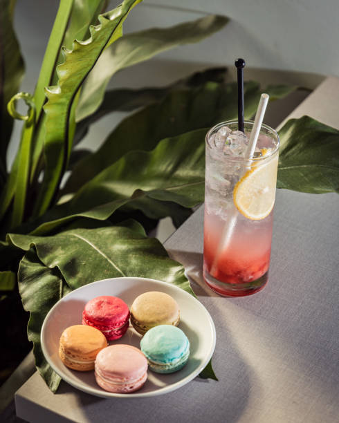 istock Multicolored macarons with specialty juice on a table 1450632223