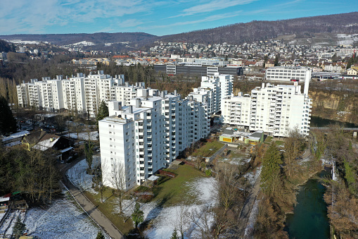 Webermühle is a large residential complex in the municipality of Neuenhof (AG). The buildings wehere realized between 1974 and 1981, they contain 368 apartments. The image was captured during winter season.