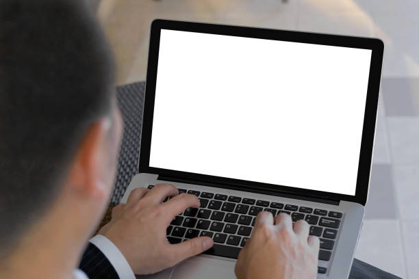 istock Selective focus of Businesssman hand touching button on Laptop keyboard. Man using computer notebook with blank screen. Man working on laptop computer with two hands. business concept with clipping path. 1450639024
