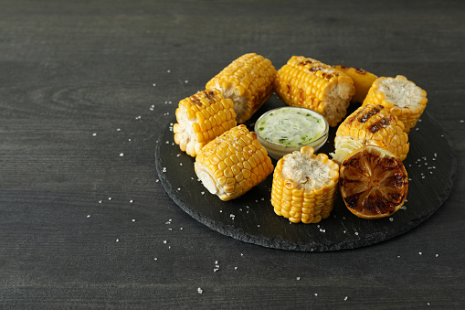 Concept of tasty food with grilled corn