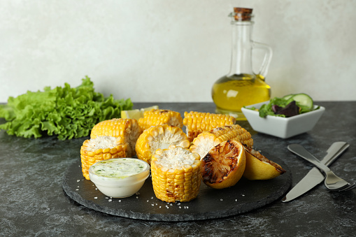 Concept of tasty food with grilled corn