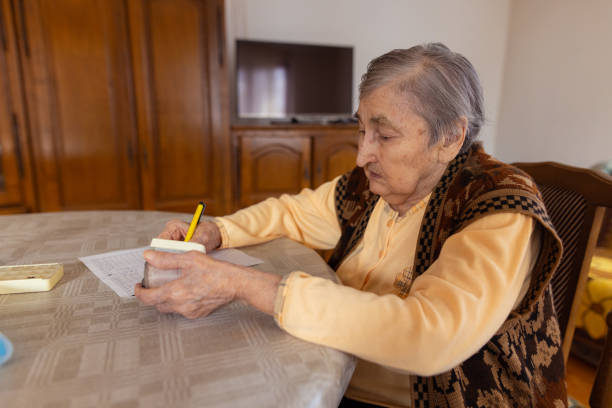 istock Senior lady doing the blood pressure test at home 1450644988