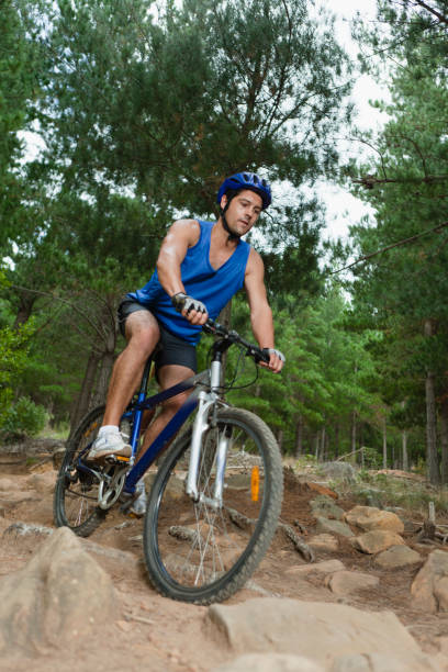 istock Man mountain biking on rocks 145064841