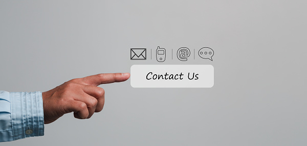 Businesswoman touching on virtual screen contact icons such as email, address, live chat, internet wifi. Contact us or Customer support hotline people connect. Connect with cyberspace.