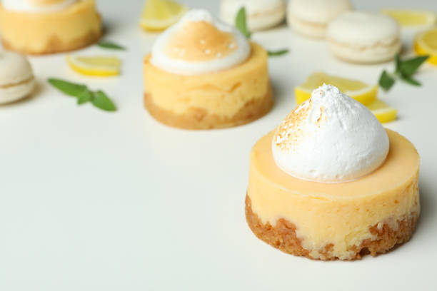 istock Lemon cupcakes, macaroons and ingredients on white background 1450649631