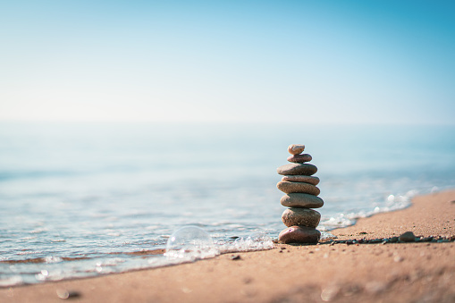 Pile of stones on the calm beach