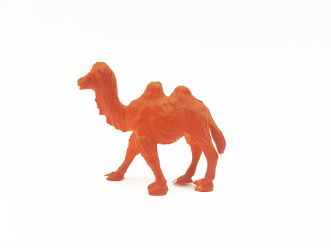 A plastic-based children's toy with a brown camel animal character on a white background