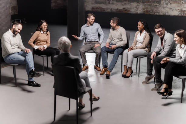 istock Cheerful entrepreneurs laughing during a group therapy in the office. 1450654051