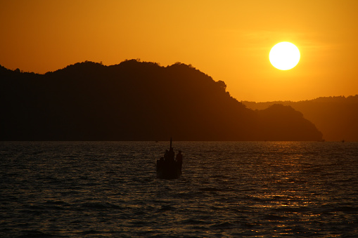 The view of fishing boats against the background of a very beautiful sunset in aceh