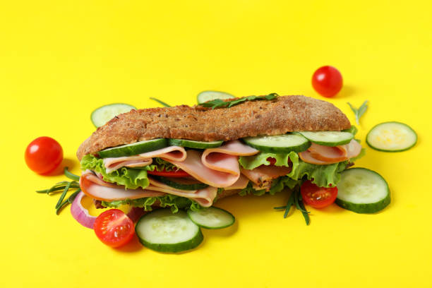 istock Ciabatta sandwich and ingredients on yellow background 1450658018