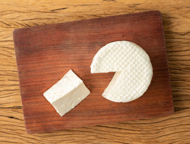 istock Frescal cheese, typical brazilian fresh white cheese with slice over wooden table 1450658506