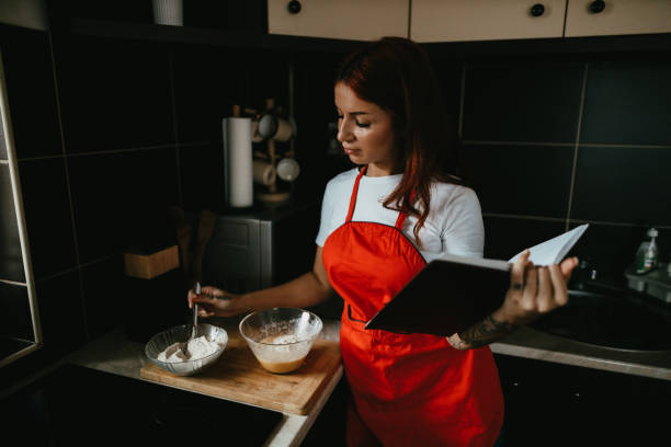 istock Smiling woman making vegan pancakes for breakfast 1450659133