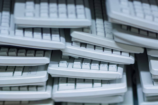 Electronics Recycling, stack of keyboards. stock photo