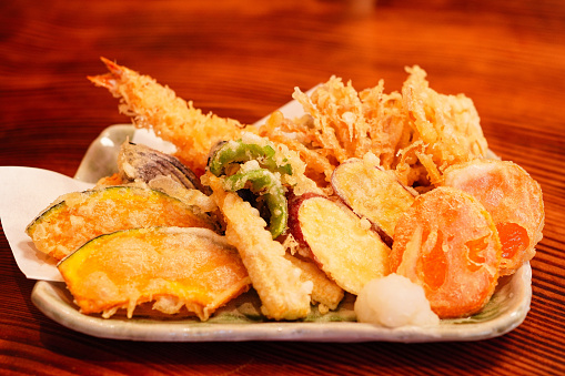 Japanese dish of seafood and vegetables coated in a very light batter and deep-fried