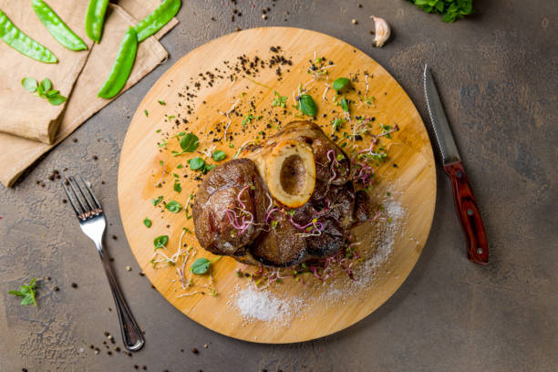 istock veal knuckle in Bavarian style on wooden board top view 1450668295