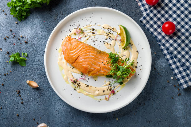 istock Salmon steak on the grill top view 1450668299