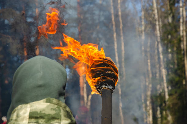 istock a burning torch for ignition. Flame on a homemade torch 1450673790
