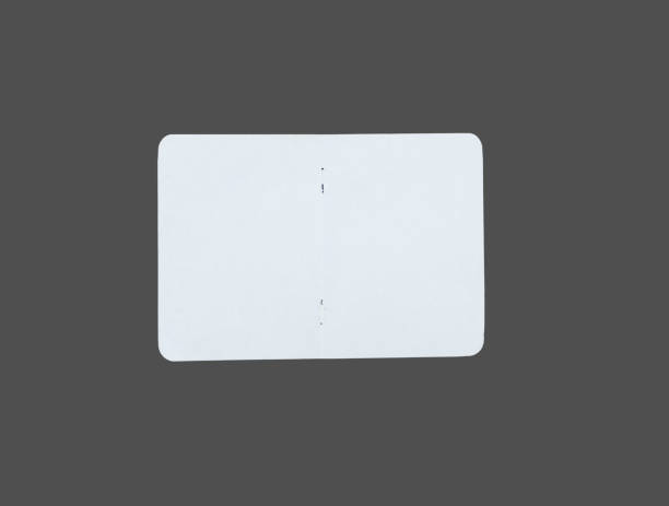 istock White ripped note, notebook paper stuck with sticky tape on black background. 1450675495