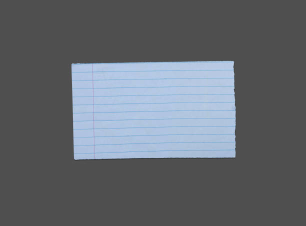 istock White ripped note, notebook paper stuck with sticky tape on black background. 1450675504