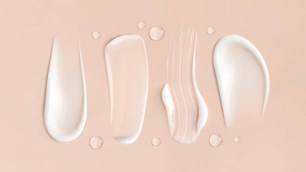 cosmetic smears cream texture on beige background