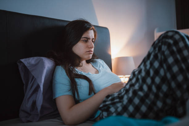 istock Woman laying sick at home. 1450677128