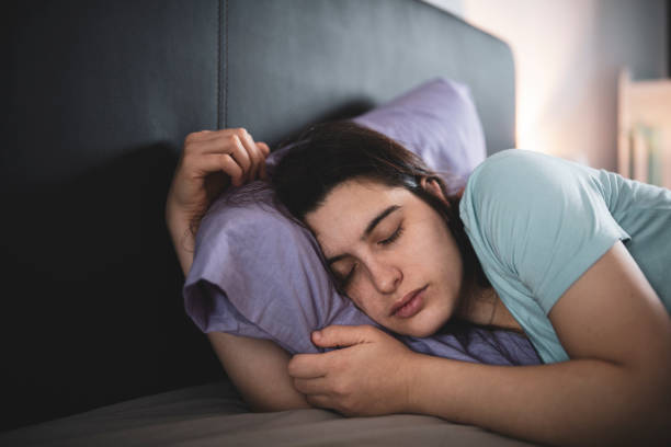 istock Young woman sick in bed sleeping. 1450677139