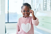 Shop, glasses and eyes of black child with vision healthcare, frame check or choice in retail with kids medical insurance. Eye care, store and african girl with lens for promotion sale. or marketing