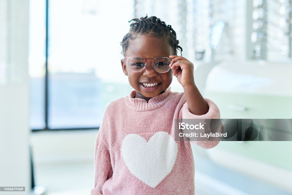 Shop, glasses and eyes of black child with vision healthcare, frame check or choice in retail with kids medical insurance. Eye care, store and african girl with lens for promotion sale. or marketing Child Stock Photo