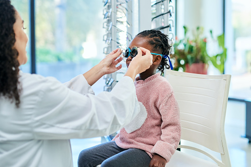 Kids optometrist, glasses and vision doctor, optometry and consulting in optical store. Eye care, test and healthcare service for girl child, eye exam and help check lenses, eyesight and consultation
