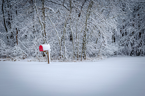 Rural mailbox along a country road after a snowstorm.