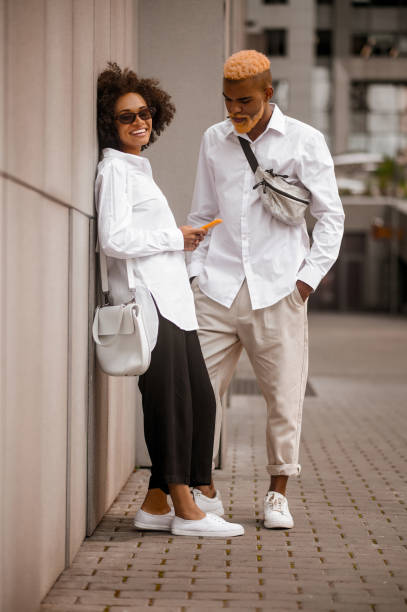 istock A couple standing near the wall and talking 1450678789