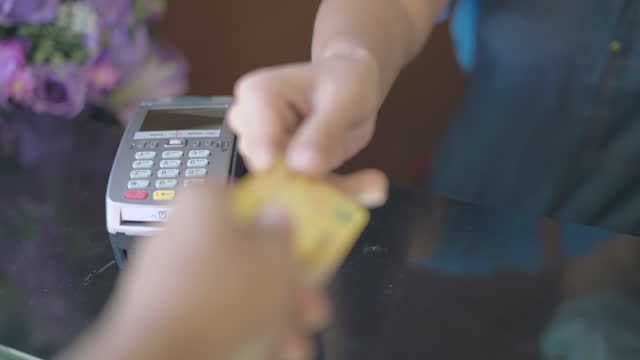 Shop Owner Swiping Credit Card Through Terminal Machine Slow Motion