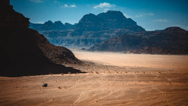 istock 4x4 car in the wadi rum desert. 1450682089