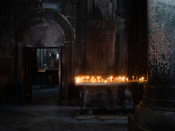 istock Church table with candles, in an old monastery. Geghard Monastery in Armenia. 1450683065