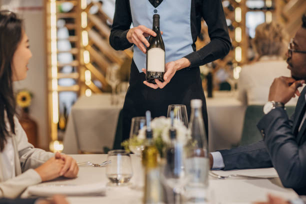 istock People in luxury restaurant 1450685391