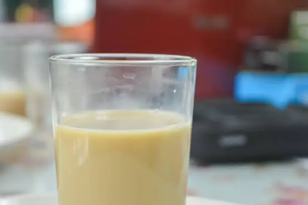 Photo of Close up view of Nescafe tarik. Made from a mixture of nescafe and milk as well as hot water. Suitable for morning and afternoon tea. favorite drink in Malaysia.
