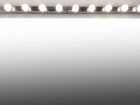 Front view make-up mirror with electric lamps. Mirror frame with reflection and clipping path