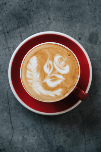 istock A cup of cuppuccino with rose on top on the table 1450694530