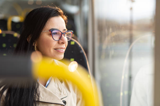 istock Young woman sitting in bus 1450698111